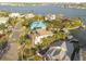 An aerial view of a house by the water, with surrounding homes visible at 238 71St Ave, St Pete Beach, FL 33706