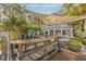 Wooden dock with shade sail, overlooking the water at 238 71St Ave, St Pete Beach, FL 33706