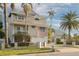 Two-story house with a white garage door and a paved driveway at 238 71St Ave, St Pete Beach, FL 33706
