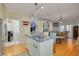 Bright kitchen features a large island with a double sink and access to laundry and Gathering room at 238 71St Ave, St Pete Beach, FL 33706