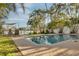 Inviting pool area with brick pavers and lush landscaping at 238 71St Ave, St Pete Beach, FL 33706