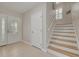 Interior view of staircase with light wood steps and white risers at 238 71St Ave, St Pete Beach, FL 33706
