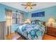 Cozy bedroom featuring a comfortable bed and beachy decor at 2530 Oakleaf Ln # 31A, Clearwater, FL 33763