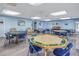 Community room with multiple tables and chairs at 2530 Oakleaf Ln # 31A, Clearwater, FL 33763