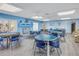 Community room with tables, chairs, and fireplace at 2530 Oakleaf Ln # 31A, Clearwater, FL 33763