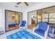 Bright Florida Room with sliding doors and wicker chairs at 2530 Oakleaf Ln # 31A, Clearwater, FL 33763