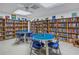 Community library with bookshelves and tables at 2530 Oakleaf Ln # 31A, Clearwater, FL 33763