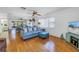 Living room features a blue sofa, ottoman, and large mirror reflecting the space at 2530 Oakleaf Ln # 31A, Clearwater, FL 33763