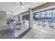 Covered patio overlooking the pool and deck chairs at 2530 Oakleaf Ln # 31A, Clearwater, FL 33763