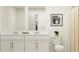 Modern bathroom with double vanity and shower at 2646 Sunray Venus Way, Ruskin, FL 33570