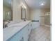 Double vanity bathroom with corner tub and shower at 2741 Via Cipriani # 930A, Clearwater, FL 33764