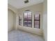 Bedroom with three windows and tiled floors at 2741 Via Cipriani # 930A, Clearwater, FL 33764