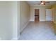 Bedroom with access to bathroom with tiled floors at 2741 Via Cipriani # 930A, Clearwater, FL 33764