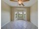 Bright bedroom with bay window, ceiling fan, and tile floors at 2741 Via Cipriani # 930A, Clearwater, FL 33764