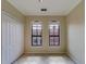 Bright bedroom with two windows and tiled floors at 2741 Via Cipriani # 930A, Clearwater, FL 33764