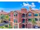 Mediterranean-style condo building with balconies and palm trees at 2741 Via Cipriani # 930A, Clearwater, FL 33764
