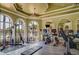 Well-equipped fitness center with various exercise machines and large windows at 2741 Via Cipriani # 930A, Clearwater, FL 33764