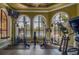 Fitness center with modern equipment and pool view at 2741 Via Cipriani # 930A, Clearwater, FL 33764