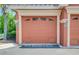 Reserved parking space in front of a tan garage door at 2741 Via Cipriani # 930A, Clearwater, FL 33764