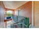 Indoor staircase with teal railings and peach walls at 2741 Via Cipriani # 930A, Clearwater, FL 33764