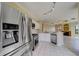 Stainless steel appliances and white cabinets in this open concept kitchen at 2741 Via Cipriani # 930A, Clearwater, FL 33764