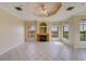 Bright living room with fireplace and large windows at 2741 Via Cipriani # 930A, Clearwater, FL 33764