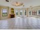 Spacious living room with fireplace and tile floors at 2741 Via Cipriani # 930A, Clearwater, FL 33764