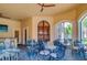 Outdoor patio with tables and chairs, perfect for dining at 2741 Via Cipriani # 930A, Clearwater, FL 33764