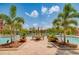 Inviting pool area with lounge chairs and a patio table at 2741 Via Cipriani # 930A, Clearwater, FL 33764