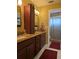 Double vanity bathroom with granite countertops and shower at 3562 90Th N Ter, Pinellas Park, FL 33782