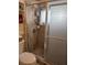 Shower stall with tiled walls and frosted glass door at 3562 90Th N Ter, Pinellas Park, FL 33782