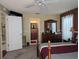 Bedroom with ensuite bathroom access and dresser at 3562 90Th N Ter, Pinellas Park, FL 33782