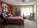 Bedroom with wood furniture, ceiling fan and sitting area at 3562 90Th N Ter, Pinellas Park, FL 33782