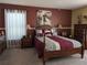Spacious bedroom with wood furniture and large window at 3562 90Th N Ter, Pinellas Park, FL 33782