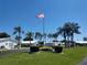 Community entrance with flag and landscaping at 3562 90Th N Ter, Pinellas Park, FL 33782