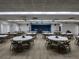 Large community hall with tables and chairs, ideal for events at 3562 90Th N Ter, Pinellas Park, FL 33782