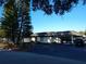 The Mainlands Golf Club building with parking and golf carts at 3562 90Th N Ter, Pinellas Park, FL 33782
