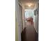 Hallway with hardwood floors and access to living room at 3562 90Th N Ter, Pinellas Park, FL 33782