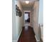 Bright hallway with hardwood floors and built-in closet at 3562 90Th N Ter, Pinellas Park, FL 33782