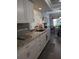 Modern kitchen with granite countertops and white cabinets at 3562 90Th N Ter, Pinellas Park, FL 33782