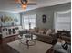 Living room with hardwood floors, a neutral color scheme, and ample natural light at 3562 90Th N Ter, Pinellas Park, FL 33782