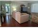 Living room with hardwood floors, sofa and TV at 3562 90Th N Ter, Pinellas Park, FL 33782