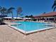 Community pool with ample deck space for lounging at 3562 90Th N Ter, Pinellas Park, FL 33782