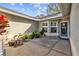 Inviting front patio with potted plants and a spacious walkway at 412 Arlington E Ave, Oldsmar, FL 34677