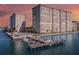 Aerial view of waterfront property with two high-rise buildings, a pool, and boat slips at 5200 Brittany S Dr # 1110, St Petersburg, FL 33715