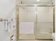 Bathroom with shower/tub combo and tiled walls at 5200 Brittany S Dr # 1110, St Petersburg, FL 33715
