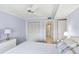 Bedroom with water view, ceiling fan, and closet at 5200 Brittany S Dr # 1110, St Petersburg, FL 33715
