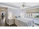 Bedroom with water view, ceiling fan, and nightstands at 5200 Brittany S Dr # 1110, St Petersburg, FL 33715