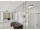 Bright entryway with mirrored walls, a bench, and tiled floor at 5200 Brittany S Dr # 1110, St Petersburg, FL 33715