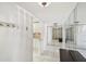 Entryway with mirrored walls, tiled floors, and a bench at 5200 Brittany S Dr # 1110, St Petersburg, FL 33715